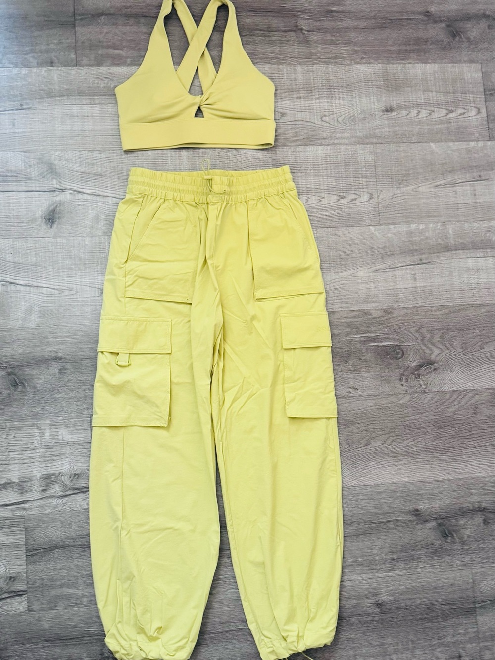 Fabletics Oasis Twist Medium Impact Sports Bra & Heights Cargo Pant Matching Set